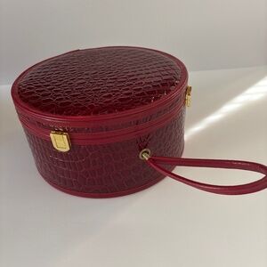 Round vinyl carrying case Nordstrom brand.